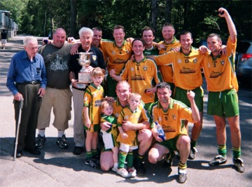 From left to right back row: Pat Callaghan, Carndonagh, Darren Duffy, team selector Malin, Connie McEleney, honoury club president, John Deery, Malin, Jonathan Byrne, Malin, Rory Grant, Burt, Emmet McLaughlin, Moville, Danny Friel Urris, Shane Kelly, Urris, Damian Harkin, Urris. Front row: Eamonn Kelly, team manager and player, Buncrana, with children and Paul Friel, team captain, Urris.