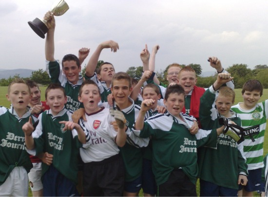 The triumphant Crana College U14s celebrate with the champions' trophy.