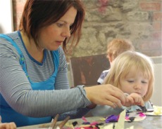 Putting the finishing touches to a spooky art work during the 'Our Time' Halloween party at Artlink.