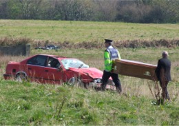 A coffin is carried into the field to remove the remains of Hugh Donegan.