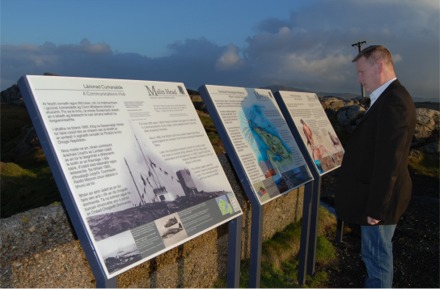 Sinn Fin candidate Sean Ruddy reads the information panels at Banba's Crown.