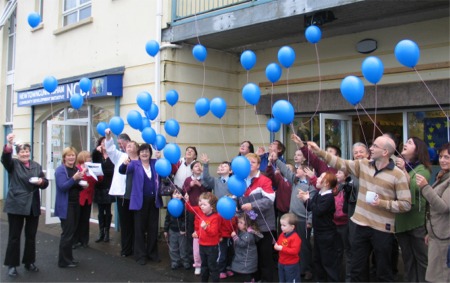 Members of NCDI and locals celebrate the culmination of this year's Peace II events in Newtown.