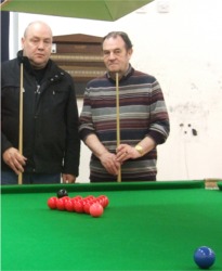 Paddy Doherty, left, and John Crumlish. At back are the holes in the wall left when the coin meters were ripped out.