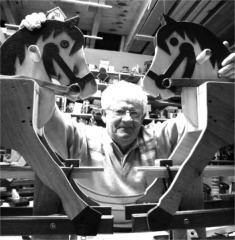 Thomas The Millar Doherty with wooden toys he made in his workshop.