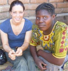 Emma shells some peanuts with one of the villagers in Lilongwe, Malawi.