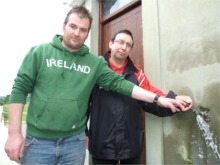 Seamus White, left, and Albert Doherty say water bills will financially cripple Carn FC.